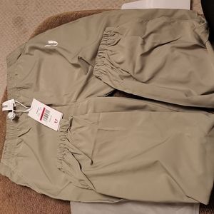 Wind breaker with pants. Brand new n never worn.  color is a light olive green.